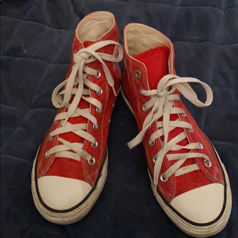 Red canvas Converse Chuck Taylor high top sneakers